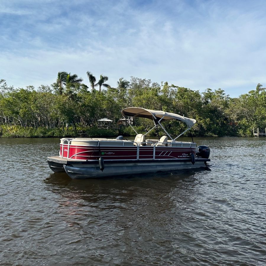 Pontoon boat near Fort Myers Beach with turquoise Gulf water